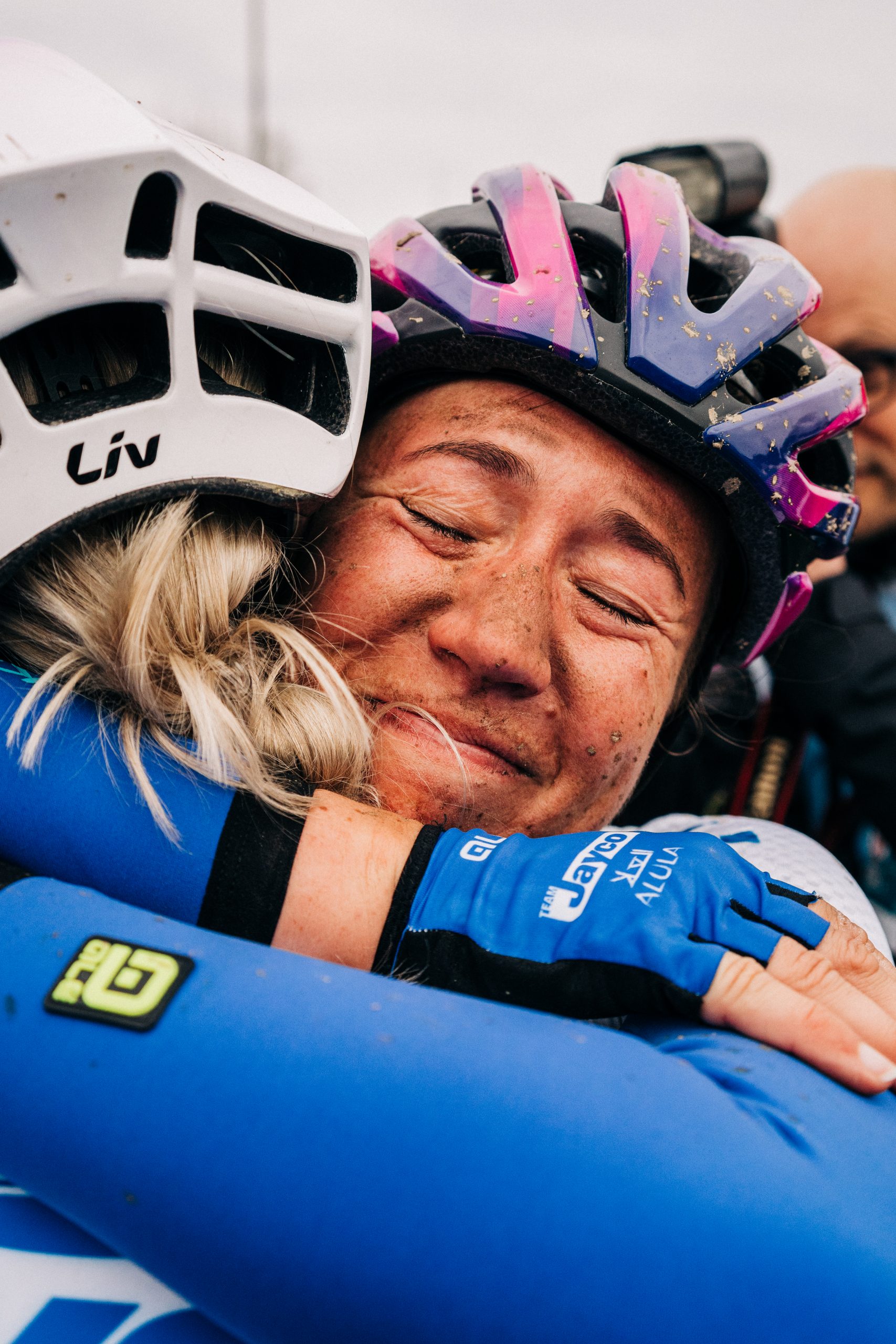riders hugging at Paris-Roubaix Femmes finish