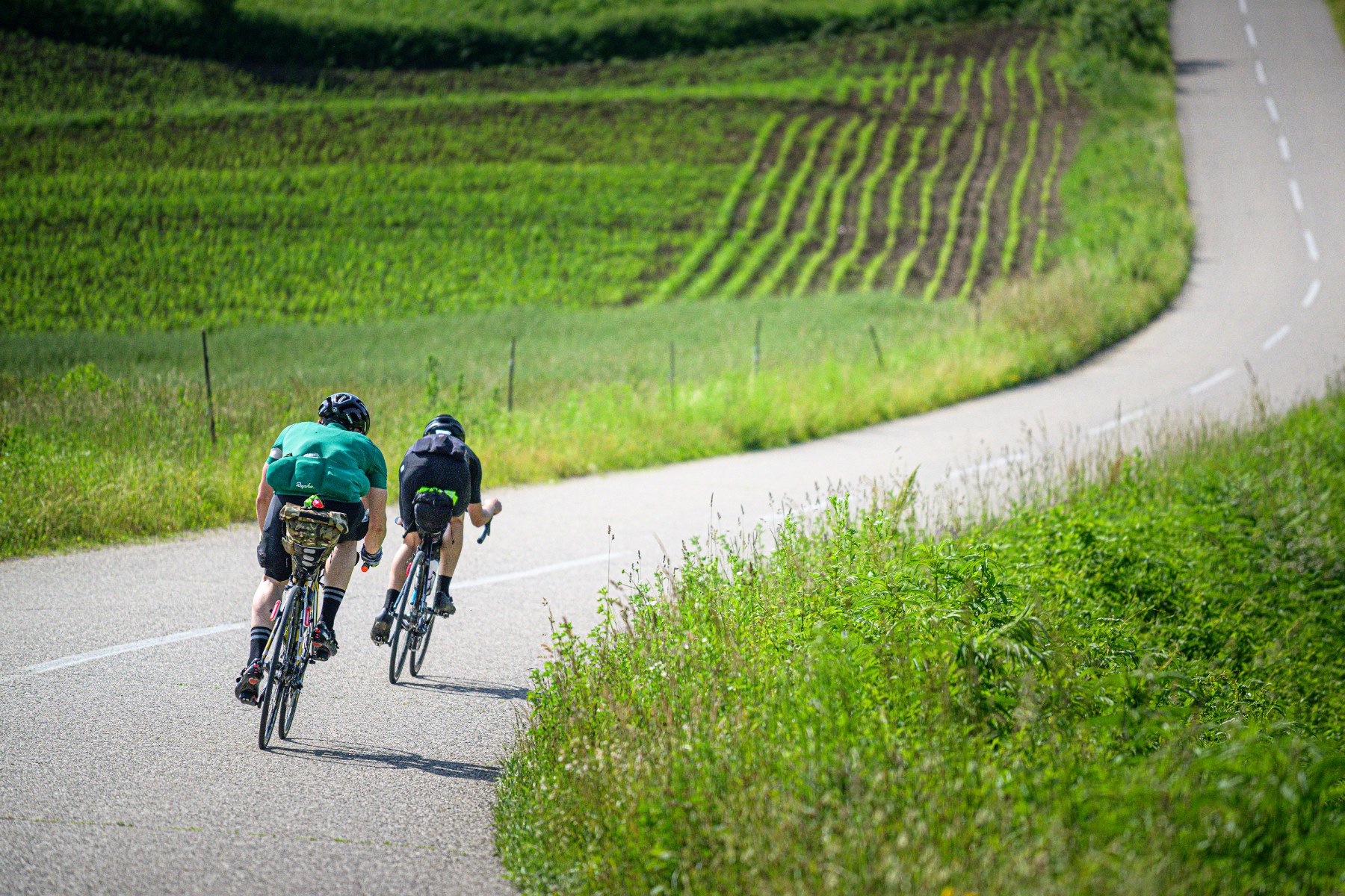 two cyclists descending