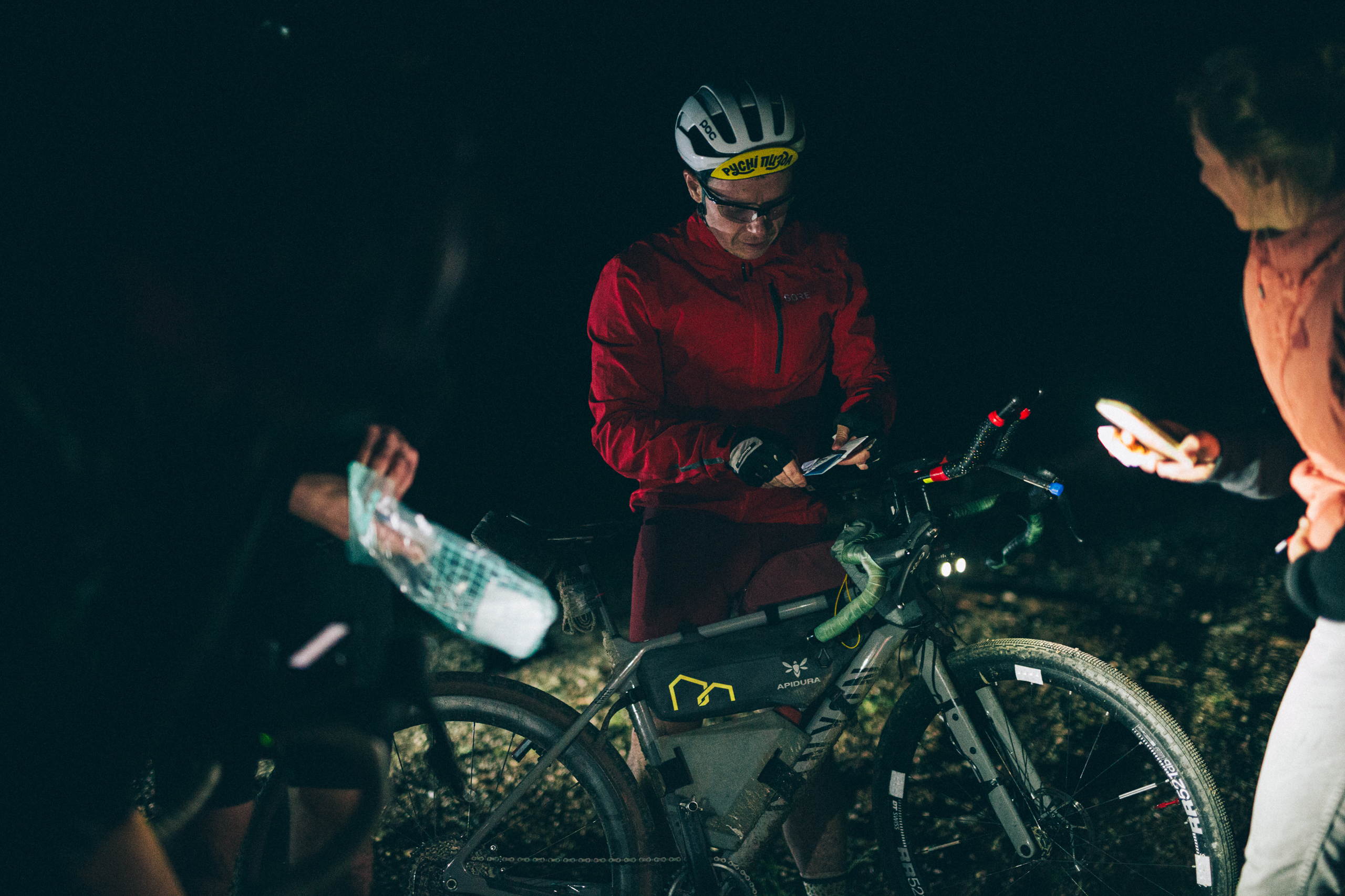 gravel cyclist at night